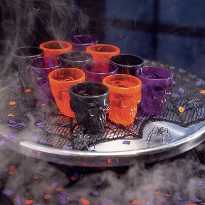 Planning a Halloween party for adults? Don't forget the Halloween shot glasses! A must-have addition to any boo bash, this tableware is unique, eye-catching, and will make your drinks table the centerpiece of the party. You and your guests will love the clever design and classic seasonal colors! The skull design is featured on both sides of the shot glass. | The Holiday Aisle® Niota 12 Piece 2 oz. Plastic Shot Glass Set Plastic, Size 2.25 H x 2.25 W in | Wayfair Halloween Party For Adults, Candy Table Signs, Halloween Shot Glasses, Party For Adults, Halloween Candy Bar, Halloween Shots, Halloween Party Drinks, Boo Bash, Hallowen Party