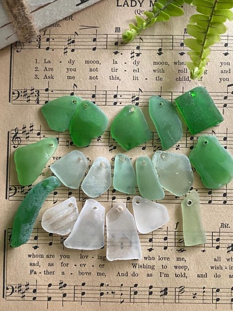 18 freshly found pieces of beach glass from Florida; more craft quality than jewelry quality, but perfect for making a mobile or ornaments!  If you rub a little oil on them, they will glow as if still damp from the ocean, very pretty! { 2mm holes, 3/4" to 1.75" } Gift From The Sea, Make A Mobile, Sea Glass Beads, Beach Glass, Repurpose, Craft Gifts, Jewelry Supplies, Sea Glass, Gift Baskets