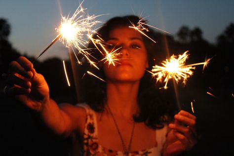 Girl with dark hair holding two sparkers and staring at the camera Pictures With Sparklers Night, Sparkler Photoshoot, Sparklers Photography, Firework Candles, Candle Photoshoot, Sparkler Photography, Night Shoot, Party Photoshoot, Party Poppers