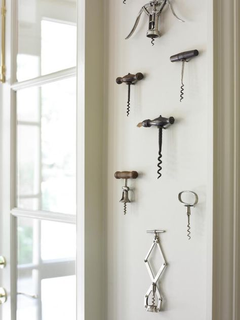 Vintage Corkscrews Hang on Wall