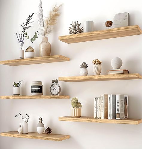 PRICES MAY VARY. Real Wood Floating Shelves: Crafted from solid wood for a durable and sturdy design. PHPH wood floating shelves with natural wood grain give a rustic feel to any space. Modern Rustic floating shelves: PHPH modern rustic floating shelves provide a industrial look that will blend well with modern and farmhouse wall decor alike. You are sure to make a welcome addition and a warm touch to your bathroom, kitchen, bedroom, or living room. Display Decor Floating Shelves: The rustic flo Wall Shelves Design Dining Room, Gold Floating Shelves Kitchen, Rustic White Shelves, Shelving For Bedroom Wall, Floating Shelves Dining Room Wall Decor, Floating Shelves On Big Wall, Simple Shelves Ideas, Multiple Floating Shelves On Wall, Natural Wood Wall Shelves