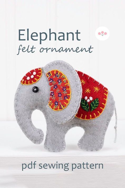 Sew your own Ella the Elephant, an embroidered felt elephant ornament.Ella measures 8cm / 3.5 inches high and has a cotton loop for hanging.The pattern includes detailed instructions and step by step photos, with actual size templates.All the stitching is done by hand - you don't need a sewing machine.#feltornaments #handmadechristmasornaments Felt Applique Ideas, Sewing Patterns Christmas, Christmas Ornament Sewing, Felt Elephant, Diy Felt Christmas Ornaments, Felt Ornaments Patterns, Baby Mobil, Felt Animal Patterns, Felt Crafts Patterns