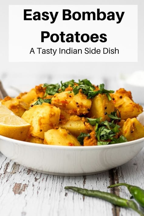 These easy bombay potatoes are a spicy Indian side dish. They're delicious as part of a homemade Indian meal and are a great alternative to ordering a takeaway! Homemade Curry Recipe, Indian Potatoes, Curried Potatoes, Bombay Potato Recipe, Bombay Potatoes, Indian Side Dishes, Indian Meal, Vegetarian Curry, Vegan Side Dishes