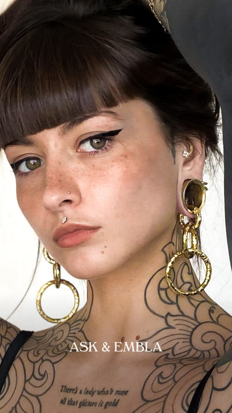 Take cues from @goldie.tatts with the way she stacks our hangers and tunnels — truly a sight to behold.⁠ ⁠ Jewelry featured:⁠ Large Hammered Halo Hangers⁠ Testament Tunnels in Gold ⁠ Daya Threadless End 3 Lobe Piercings, Stretched Ear, Ring Stacks, Tattoed Women, Pin Up Tattoos, Cute Piercings, Ear Weights, Big Big, Lobe Piercing