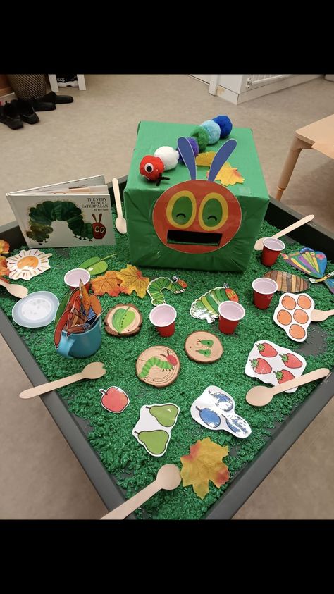 Infant Provocations, Book Week Tuff Tray Ideas, Hungry Caterpillar Tuff Tray, Eyfs Story Activities, Tuff Tray Ideas 2-3, The Hungry Caterpillar Eyfs, Fairytale Tuff Tray Ideas, The Very Hungry Caterpillar Eyfs Tuff Tray, Book Themed Tuff Tray