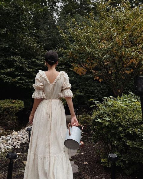 Lainy Hedaya @lainyhedaya wears the Evangeline dress in Cream Kala Cotton. The Evangeline dress is elegant simplicity at its best. Simple yet beautiful details make this dress feel oh so special – the delicate ruffle, lace edging, and ribbon sash. Made from an artisan, handwoven fabric it has a lightweight, gauzy airiness that is perfect for the hottest days of summer. Fully lined with deep pockets. Lace Up Dresses, Groovy Wedding Dress, Romantic Summer Style, Vintage Cottagecore Aesthetic Outfits, Elegant Vintage Outfits, 19th Century Fashion Women, Romantic Summer Outfits, Evangeline Dress, Delicate Outfits