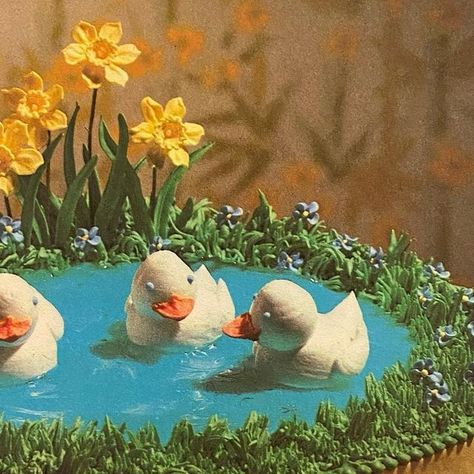 Jess on Instagram: "Ducklings Afloat on a Pond Cake (The Wilton Way of Cake Decorating, 1979) #vintagecookbooks#vintagefood#retrofood#weirdfood#vintagefoodstyling#oldcookbooks#cakedecorating#duckcake#ducklingcake#springcake#pondcake#vintagecake#retrocake#animalcake#1970s#1970sfood#1970scooking#1970scookbook#70scake#1970scake" Pond Cake Decoration, Pond Cake, Vintage Animation, Box Cakes, Wilton Cakes, Hens And Chicks, A Pond, Vintage Cookbooks, Bento Box Lunch