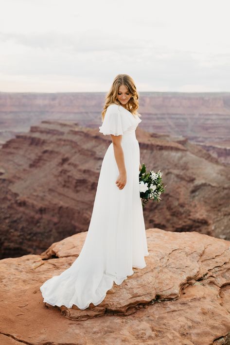 Nicole Aston Photo, Provo City Center Temple Bridals, bridal pose inspo, Dead Horse Point bridals, Moab wedding, Moab elopement, LDS bridals, wedding dress inspo, adventurous wedding Modest Wedding Dress Simple, Wedding Dresses Modest Plus Size, Cream Colored Wedding Dress Simple, Modest Minimalist Wedding Dresses, Summer Country Wedding Ideas, Modern Lds Wedding Dress, Modest Wedding Dresses A-line, Modest Wedding Dress With Sleeves, Beach Wedding Dress Modest