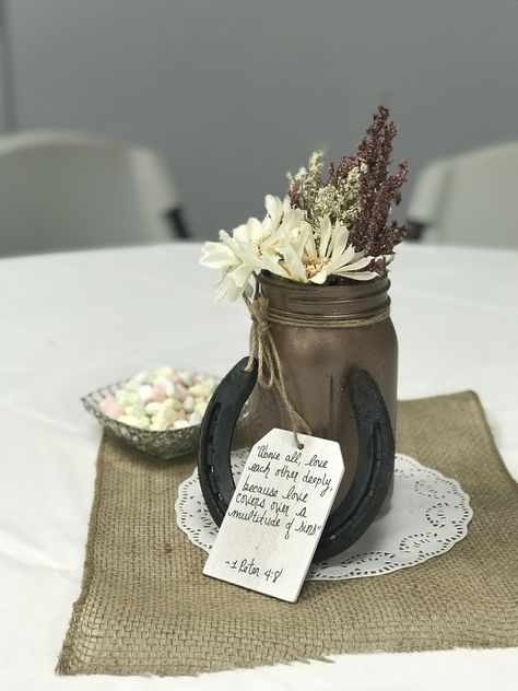 I love this centerpiece that I made for a wedding. Filled with love from the different verses I wrote on the tags with my little touches of my rustic roots from the farm I grew up on with the horseshoes. #unshakeablegrounds Horseshoe Centerpieces Wedding, Horseshoe Centerpieces Ideas, Western Theme Party Centerpieces, Horseshoe Centerpieces, Cowboy Centerpiece Ideas, Western Party Centerpieces, Western Wedding Centerpieces, Holiday Hoedown, Western Centerpieces