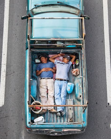 carpoolers by alejandro cartagena (2012). his critically acclaimed photo project captured bird’s-eye-view images of mexican workers commuting to their jobs in the beds of pickup trucks. “construction workers were buying houses an hour or more away from where they worked and there is no public transportation for them, so i started documenting how people used their cars,” cartagena explained about the project, “how they drive to work or drive home, how they personalize their cars based on t... People In Public, Growth And Decay, Boat Party, Photography Pricing, Aerial Photo, Contemporary Photography, Photo Series, Photo Projects, Birds Eye