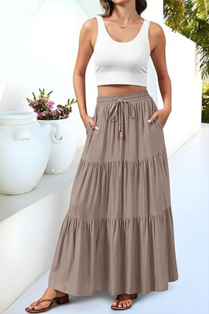 Our skirt features an drawstring elastic high waist design, ensuring you a better fit while emphasizing your curves for an eye-catching silhouette. The drawstring with brown wooden beads makes this ruffle tiered flowy skirt more in bohemian style. FLOWY MAXI SKIRT: Crafted in timeless A-line style, this skirt falls elegantly to a maxi length, offering flowy swing movement to enhance your grace and charm that's perfect for beach, cruise, travel, vacation and summer parties. Long Beach Skirt, Flowy Maxi Skirts, High Waisted Maxi Skirt, Indie Aesthetic, Boho Summer, Fall Skirts, Flowy Skirt, Skirts With Pockets, How To Make Beads