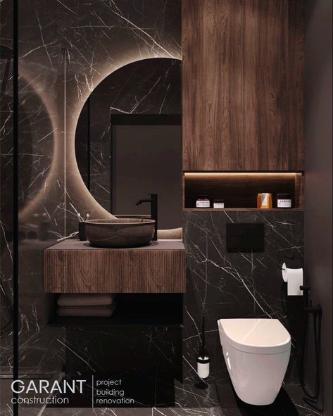 This bathroom is made in dark colors with combination of marble textures and wood. The result is stylish and bold👌 The mirror with LED creates a special atmosphere✨ Garant Construction – we create interiors of your dream!♥️