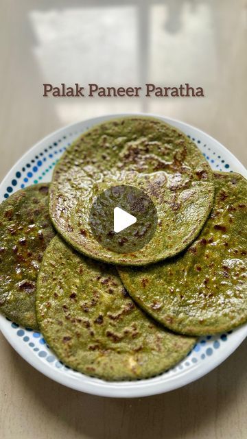 Megha | Healthy Recipes | Mindful Parenting on Instagram: "Palak Paneer Paratha is the perfect way to sneak in those greens while keeping it delicious! Packed with the goodness of iron-rich spinach and protein-loaded paneer, this wholesome paratha is a hit with kids and adults alike. Make it once, and you’ll find it becoming a regular on your family’s menu!"

Here's a recipe for Palak Paneer Paratha:

Ingredients:
For the Dough:
* 2 cups whole wheat flour
* 1 cup spinach (palak), blanched and pureed
* 1 tsp salt
* 1 tbsp oil or ghee
* Water as needed
For the Stuffing:
* 1 cup paneer, crumbled
* 1/2 cup chopped onions 
* 1 tsp ginger, grated (optional)
* 1 tsp chilli flakes 
* 1 tsp cumin powder
* 1 tsp garam masala
* Salt to taste
* 2 tbsp fresh coriander, chopped
For Cooking:
* Ghee or oi Crumbled Paneer Recipes, Palak Paratha Recipe, Palak Paratha, Palak Recipe, Palak Paneer Recipe, Paneer Paratha, Paneer Recipe, Iron Rich, Paneer Recipes