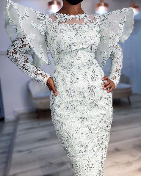 Long Lace Dress Styles Nigerian, Simple Owambe Lace Styles, Simple Nigerian Lace Styles, Aso Ebi Lace Styles 2023 Long Gown, White Cord Lace Styles, Style For White Lace Gown, Cord Lace Gown Styles Nigerian, White Cord Lace Gown Styles Aso Ebi, White Lace Gown With Lace Work