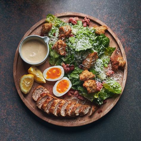 Artistry JHB on Instagram: "A Ceasar Salad with an #ArtistryJHB twist. Featuring chopped greens, parmesan, capers, sourdough croutons, egg and the classic Caesar dressing, enjoy this flavourful menu item on The Rooftop once we open early, 2023. #Artistry #TheArtistryExperience #CelebrateLife #CelebrateMoments #ArtAndCulture #ArtLovers #Foodies #FoodiesOfSA #CulturalFusion #Sandton" Caesar Salad Plating Ideas, Ceasar Salad Plating Ideas, Salad Plating Presentation, Salad Plating, Sourdough Croutons, Salad Presentation, Fine Dining Plating, Parmesan Salad, Yacht Week