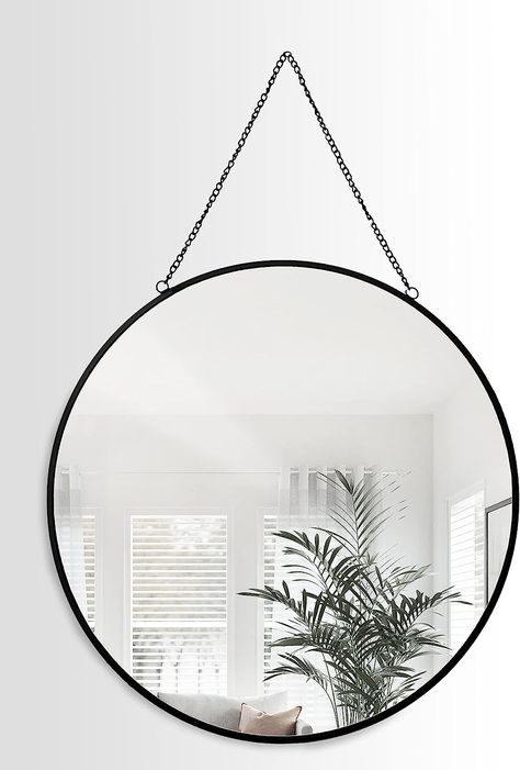 A wall mirror with a round frame adorned with black metal rims and a sleek chain, measuring 40cm in diameter. Beautiful feature for your bedroom and lounges. Round Mirror Bedroom, Entrance Mirror, Mirrors For Makeup, Mirror Bedroom, Circle Mirror, Mirror Round, Simple Chain, Leather Wall, Circular Mirror