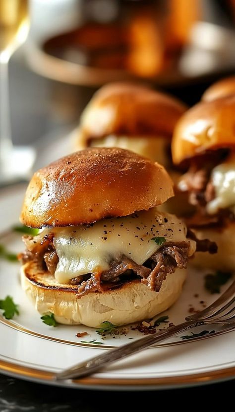 Enjoy the flavors of a classic Philly cheesesteak in mini slider form! These Philly Cheesesteak Sliders are packed with tender steak, melty cheese, and sautéed peppers and onions, all in a soft slider bun. Perfect for parties or game day snacks. Sauce For Sliders, Sliders For Party, Mini Burger Sliders, Philly Cheesesteak Sliders Recipe, Mini Burgers Sliders, Mini Slider, Philly Cheesesteak Sliders, Philly Sandwich, Cheesesteak Sliders