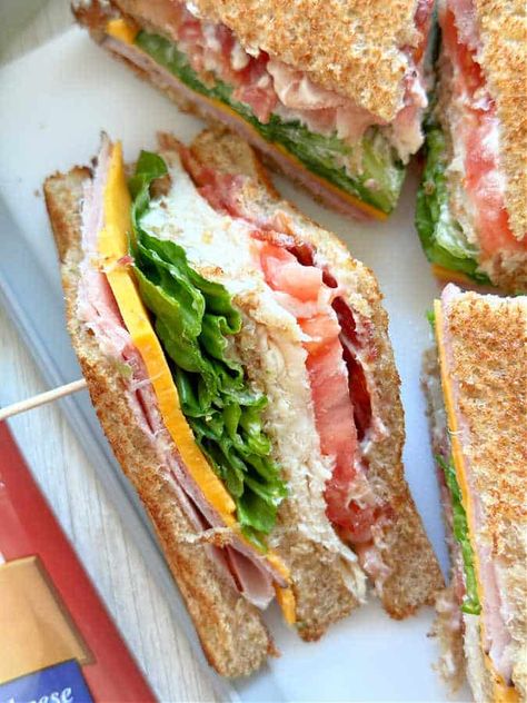 Sandwich Ideas Party, Easy Club Sandwiches, Sour Dough Bread Sandwiches, Homemade Club Sandwich, Grilled Club Sandwich, Club Sandwich Photography, How To Make A Club House Sandwich, How To Make A Club Sandwich, Hand Sandwiches