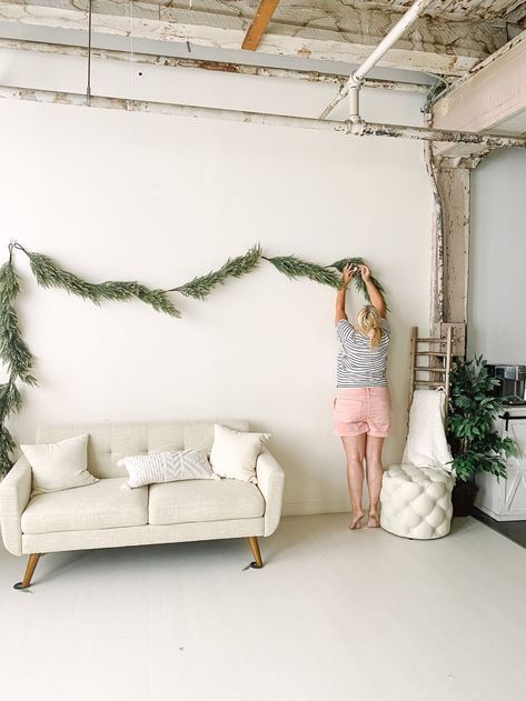 White Wall Christmas Photoshoot, Simple Holiday Backdrop, Mini Session Ideas Christmas, Christmas Indoor Mini Sessions, Cozy Holiday Photoshoot, White Christmas Studio Photoshoot, Christmas Mini Sessions Indoor Setup, Simple Studio Christmas Mini Sessions, Indoor Christmas Photoshoot Set Up