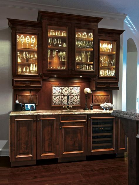 Traditional dry bar with glass-front cabinets, inner-cabinet lighting, and under-cabinet lighting. | Photo Source: HGTV Functional Cupboard, Basement Kitchenettes, Basement Wet Bar Ideas, Wet Bar Cabinets, Wet Bar Basement, Bar Cabinet Design, Basement Wet Bar, Wet Bar Designs, Counter Lighting