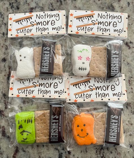 Prepare for a spooktacular Halloween with our Spooky S'mores Halloween Treat Bags, the perfect treat for goblins, ghosts, and ghouls of all ages! These adorable bags are filled with all the essential S'mores ingredients you need for a sweet and hauntingly delicious experience. What's Inside: - Mini Hershey's Milk Chocolate Bar: Rich and creamy, it's the perfect chocolatey foundation for your S'mores creation. - Peeps Marshmallow Ghost or Pumpkin: These ghostly marshmallows add a playful and eeri Smores Halloween Treats, S'more Gift Ideas, Smores Treat Bags, Ghost Smores Kits, S’mores Goodie Bags, Individual S’mores Kits, Individual S’more Kits, Halloween Treat Bag Ideas, Peeps Party