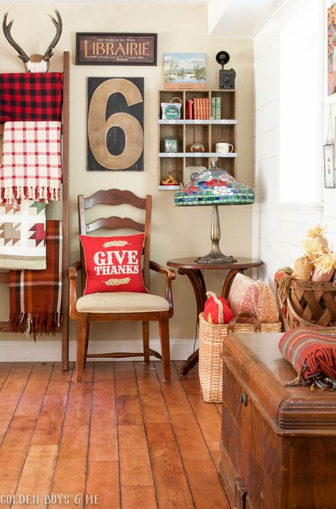 DIY ladder with plaid blankets and quilts and gallery wall… Display Pendleton Blanket, Pendleton Camp Blanket Bedroom, Plaid Camping Decor, Vintage Cabin Fabric, Warm Fall Decor, Vintage Camp Blanket, Plaid Blankets, Eclectic Farmhouse, Flea Market Decorating