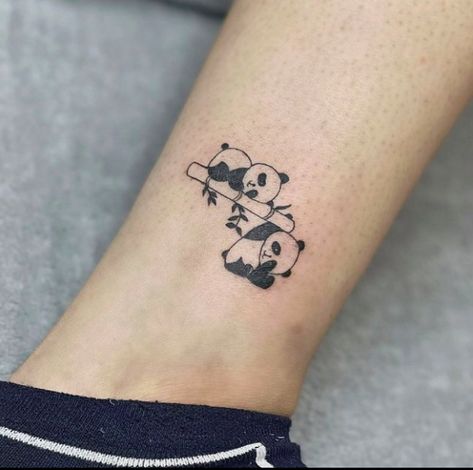 This tattoo illustrates a charming panda tattoo in chubby ink with a black coating, often called a panda bearing. They are the cutest animals. They generally dwell in jungles and eat bamboo, as shown in this tattoo of a panda... Panda And Bamboo Tattoo, The Cutest Animals, Bamboo Tattoo, Panda Tattoo, Ankle Tattoos, Cutest Animals, Ankle Tattoo, A Black, The Cutest