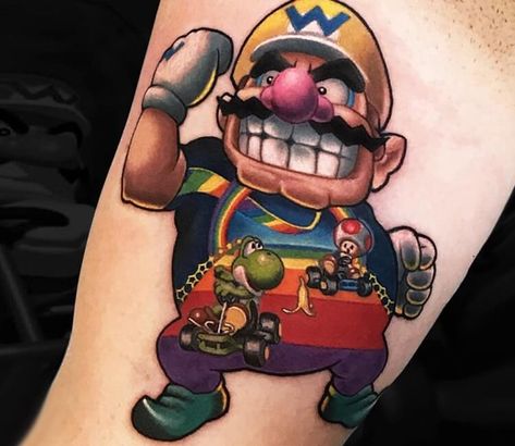 Wario tattoo by Marc Durrant Mario Tattoos, Super Mario Tattoo, Tatuaje Trash Polka, Nintendo Tattoo, Mario Tattoo, 90s Tattoos, 16 Tattoo, Gamer Tattoos, Geek Tattoo