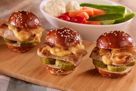 These Brat Sliders made with Hoffy Gourmet Bratwurst and homemade Pub Cheese are perfect for watching your favorite game with friends or as a “comfort food” meal anytime! Brat Sliders, Braised Onions, Pub Cheese, Game With Friends, Bratwurst Sausage, Pickle Chips, Chicken Sliders, Slider Buns, Cheese Chicken