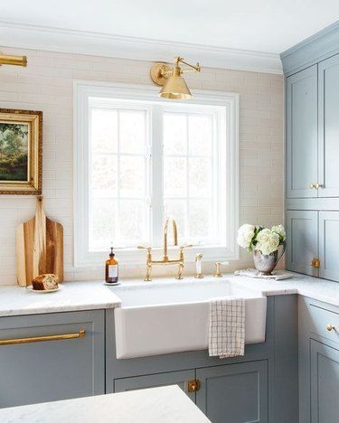 Need a little more inspiration? Scroll ahead for some of our favorite shades to pair with light blue. #lightbluehome #paintcolor #bluepaintdecor #lightbluepaint Erin Kestenbaum, White Tile Backsplash, Kitchen Cabinets Decor, Blue Tile, Brass Kitchen, Stunning Kitchens, Kitchen Tile, Apartment Kitchen, Handmade Tiles