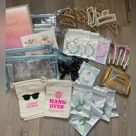 All Brand New Bridesmaid/Bachelorette Items For Asking Your Bridesmaids, Wedding Morning, Or Bach Goodie Bags! This Will Give You A Great Head Start On Gifts! The Listing Includes: 6 Hangover Pouches To Be Filled With Goodies Of Your Choice 1 Moh Bracelet With Card 3 Gold Beaded Bracelets 10 Bride Tribe Hair Ties 5 Sets Of Under Eye Gels 10 Claw Clips - 2 Pearl And 8 Gold Metal 2 Unopened Bridesmaids Cards From Rifle Paper Co 5 Pairs Of Jade Colored Hoops + 1 Pair Of Pearl Hoops 5 Lip Oils 6 Cle Bachelorette Giveaways, Bachelorette Gifts For The Bride Baskets, 21st Birthday Goodie Bags, Bridesmaid Bachelorette Gift Bags, Goody Bags For Adults, Bachelorette Bag Ideas, Bridesmaid Bachelorette Gifts, Goodie Bags For Women, Bachelorette Gifts For Bridesmaids Beach