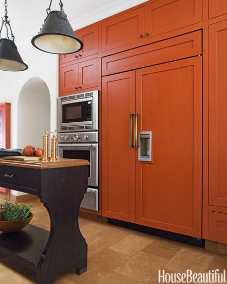 Custom pulls in unlacquered bronze have the right heft for the 48-inch Sub-Zero refrigerator doors. Burnt Orange Kitchen, Orange Cabinets, Orange Kitchen Decor, Orange Kitchen, Kitchen Cabinet Colors, Steel House, Kitchen Doors, Trendy Kitchen, Traditional Kitchen