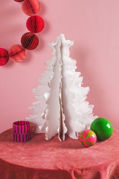 Our festive paper trees are the perfect addition to your decorating. Leaves of white paper unfurl to create a bushy effect with a traditional Christmas tree silhouette. Our paper decoration range is handmade in Jaipur using recycled paper and traditional origami techniques. The unique flat-pack paper design is great for storage. Origami Lantern, Paper Trees, Christmas Tree Silhouette, Paper Leaf, Origami Techniques, Origami Ball, Paper Decoration, Paper Leaves, Silk Paper