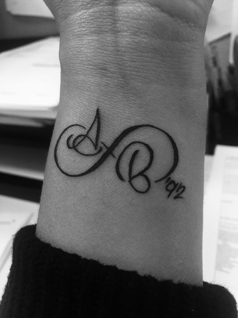 Infinity  tattoo with me and my husband's initials and the year we met. Infinity Tattoo With Year, Infinity Tattoo With Initials, Tattoo Ideas For Husband, Monogram Tattoo, Infinity Tattoo Designs, Small Shoulder Tattoos, Tattoos Infinity, Foot Tattoos For Women, Infinity Tattoos