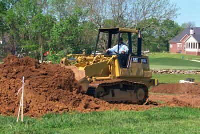 Bring in fill dirt to grade your lawn to a proper slope and reduce drainage issues. Yard Grading, Garden Soil Preparation, Gardens Australia, Preschool Construction, Yard Drainage, Organic Gardening Pest Control, Post Frame Building, Sloped Yard, Sloped Backyard