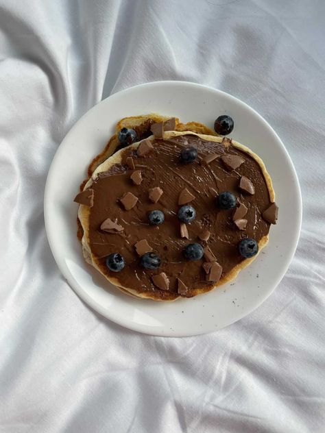 Pancake covered with nutella, chocolates and blueberries Chocolate Pancake, Chocolate Pancakes, Blueberries, Nutella, Chocolates, Pancakes