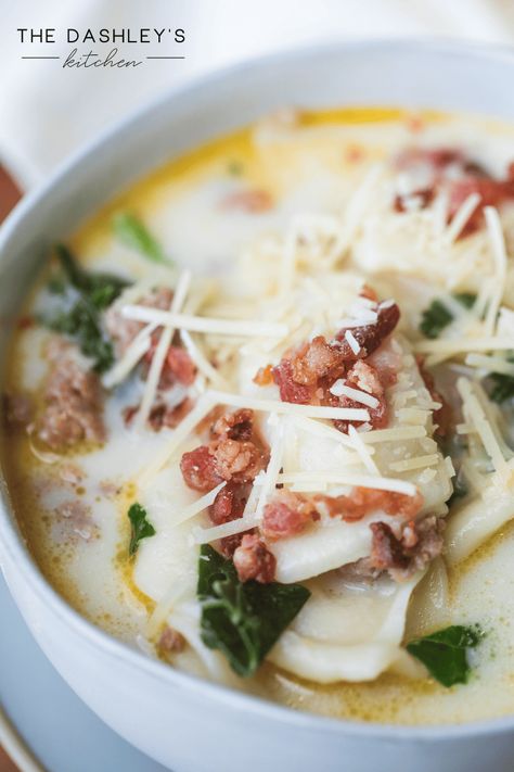 Tender veggies, pillowy pierogi and bits of savory sausage are all simmered in a creamy broth. Sausage Pierogi Soup is reminiscent of a creamy Olive Garden Zuppa Toscana. Full of flavor and depth this soup is sure to become a family favorite. A hearty recipe it is the best kind of comfort food. | Italian soup | pierogies | Mrs. T's | soup and salad | bowl of soup | dinner recipes | made from scratch | lunch and dinner | perogies | Pierogi And Sausage Recipe, Soup Dinner Recipes, Old Fashioned Potato Soup, Olive Garden Zuppa, Pork Soup Recipes, Make Sausage, Perogies Recipe, Olive Garden Zuppa Toscana, Soup Video