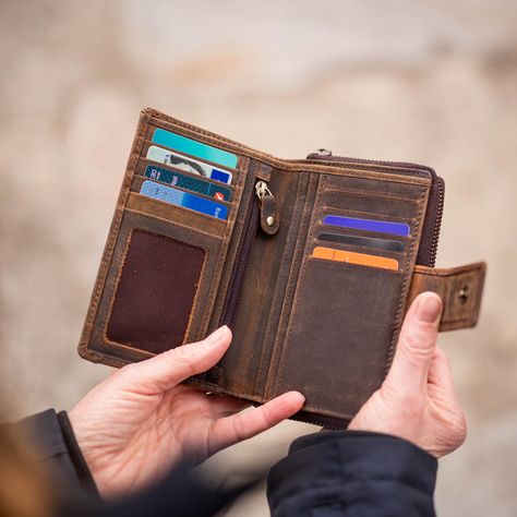 The wallet made of brown vintage genuine leather is extremely durable and robust. 
The wallet has: 1 note compartment, 1 coin compartment and 10 card slots inside.

. The integrated RFID protection ensures extra security.
——
Each piece is unique

——
Genuine buffalo leather with double stitching
——
The wallet is made of pleasantly non-slip vintage buffalo leather. The leather is natural, oiled (vegetable oil) and sanded. This means the wallet darkens over time and gets a great patina look.
——
So Brown Vintage, Buffalo Leather, Womens Purses, Vegetable Oil, Medium Size, Card Slots, Boho Fashion, Patina, Coin