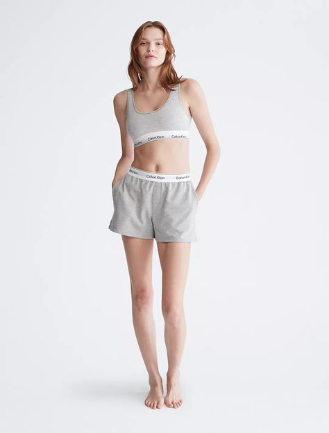 Our most iconic program, rooted in our past and reimagined for our future. These Calvin Klein modern cotton lounge sleep shorts are made from soft cotton and recycled polyester jersey for a partly sustainable design. Finished with a classic logo waistband, side pockets and seaming details. Calvin Klein Loungewear Summer Shorts, Calvin Klein Brief Bottoms For Loungewear, Calvin Klein Loungewear Shorts, Casual Calvin Klein Bottoms With Built-in Shorts, Calvin Klein Seamless Loungewear Bottoms, Calvin Klein Shorts, Sleep Shorts, Our Future, Classic Logo