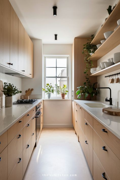 Looking for small galley kitchen ideas? Our collection of modern galley kitchen designs will inspire your next remodel. Learn how to maximize a narrow layout with clever storage solutions and sleek design choices. Save this pin to start planning your own cozy galley kitchen renovation today! Japandi Galley Kitchen, White Oak Galley Kitchen, Opening Up A Galley Kitchen, Modern Galley Kitchen Design, Cozy Apartment Kitchen, Modern Galley Kitchen Ideas, Small Galley Kitchen Ideas, Modern Galley Kitchen, Galley Kitchen Renovation