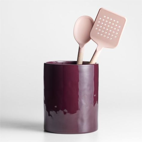 Made to complement our coveted Marin collection, this charming utensil holder exhibits the same organic lines and artisan appeal. Subtly textured stoneware gets a dip in deep wine-red glaze that's glossy and bold. We love the rich color this vessel brings to the stove or countertop, especially filled with the coordinating pink utensils for a modern, tonal look.   • Glazed stoneware  • Dishwasher-safe  • Imported Marin Merlot Red Stoneware Utensil Holder Ceramic Wine Bottle Holder, Red Ceramic Bowl, Mexican Modern Kitchen Decor, Kitchen Wares Products, Styling Kitchen Countertops, Ny Lifestyle, Ceramic Kitchen Utensil Holder, Pink Utensils, Boston Living