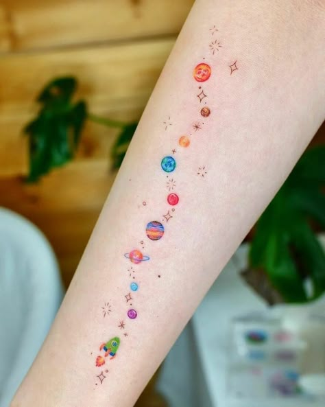 Tiny Planets And Rocket Arm Tattoo Space Arm Tattoo, Small Colorful Tattoos, Planet Tattoo, Rocket Tattoo, Space Tattoos, Cute Simple Tattoos, Planet Tattoos, Moon Tattoos, Colorful Tattoos