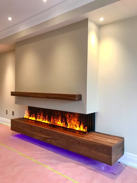 Modern fireplace. Linear fireplace. 3 sides fireplace.9’ custom water vapour fireplace. Hand made solid Walnut cabinet. Realistic Electric Fireplace, Fireplace Modern Design, Fireplace Feature Wall, Modern Electric Fireplace, Feature Wall Living Room, Fire Design, Fireplace Tv Wall, Linear Fireplace, Water Vapor