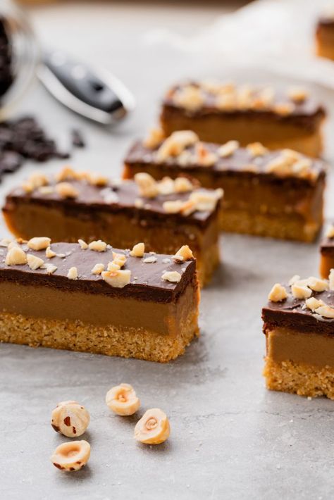 13 dessert bars and squares to mix and match for holiday gifting | Make, trade, gift, eat. [holiday baking, Hazelnut Espresso Millionaire Bars] Bars And Squares, Holiday Baking Ideas, Hazelnut Dessert, Millionaire Bars, Hazelnut Recipes, Fancy Desserts, Bakery Recipes, Cakepops, Eat Dessert