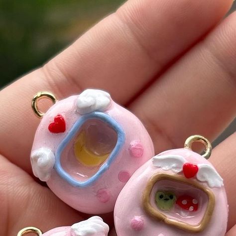 angel | kawaii clay art (´,,•ω•,,)♡ on Instagram: "yay pink tamagotchis !!  . #polymerclay #clayartist #kawaiicharms #cutecharms #cuteclay #claycharms #kawaii #cute #art #artist #sanrio #sanriocharms #cinnamoroll #usahana #badtzmaru #kuromi #mymelody #pompompurin" Clay Tamagotchi, Cinnamoroll Clay, Kawaii Clay, Cute Clay, Cute Charms, Clay Charms, Dry Clay, Air Dry Clay, Clay Art