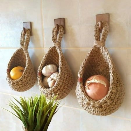 Description: Hand-woven from high quality materials, this hanging basket stores vegetables and fruit and the basket is well ventilated for long storage. Featuring a special teardrop shape, this hanging basket is very decorative and can be matched with most decorative styles, adding a touch of natural charm to your home and is very eye-catching. It is made of high quality braid fabric material. There are 6 different sizes for you to choose. This wall baskets are perfect for onions, garlic, potatoes or fruit. Item Name: Hanging Basket Material: Braid Fabric Feature: Creative, Eco-friendly, Multipurpose Size Details: Size A: 14cm x 21.5cm x 11.5cm/5.51" x 8.46" x 4.53" (Approx.) Size B: 16cm x 23cm x 11.5cm/6.3" x 9.06" x 4.53" (Approx.) Size C: 18cm x 24cm x 13cm/7.09" x 9.45" x 5.12" (Appro Hanging Wall Baskets, Onion Storage, Small Pantry Organization, Hanging Fruit Baskets, Jute Hanging, Rustic Kitchen Decor, Handmade Kitchens, Decoration Inspiration, Hanging Basket