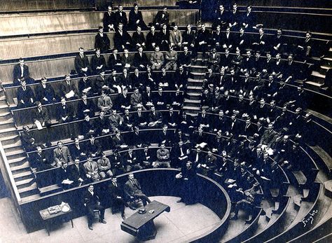 An original photograph of an anatomy class in the Upper Amphitheater, College Building (built in 1898), Jefferson Medical College, Philadelphia, early 20th century.  The person standing is holding a human skull.  The operating table at the center of the arena is the famous table of Dr. Samuel D. Gross (1805-1884), and it is represented in the Thomas Eakins painting The Gross Clinic (1875 pinterest.com/pin/287386019944359743). Thomas Eakins, College Building, Operating Table, Lecture Theatre, Digital Story, Lectures Hall, Outdoor Theater, Best Teeth Whitening, Historical Painting