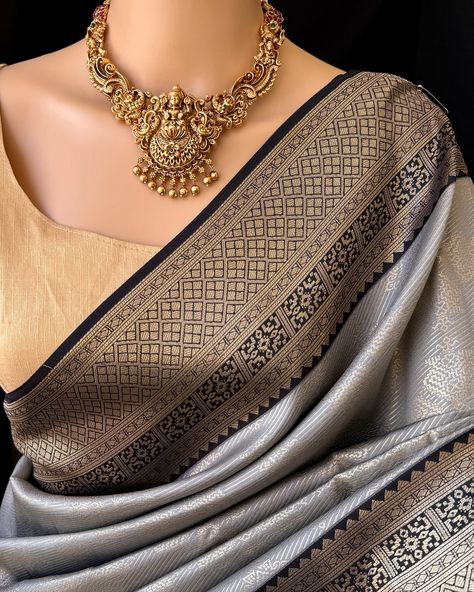 ₹ 1690/- Ash grey art silk saree with black zari border. Comes with contrast black pallu and blouse. Wash care: Normal wash. Find this saree in our website: Www.thejacouture.in> silk sarees> Ash grey art silk saree. Jewellery from: @anvi__jewellery #saree #artsilksarees #greysaree #sareelove #traditionalsaree #sareestyle #sareedraping #jewellery Silk Saree Jewellery, Grey Silk Saree, Grey Saree, Saree Jewellery, Art Silk Sarees, Grey Art, Gray Silk, Traditional Sarees, Saree Styles