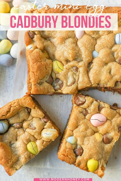 These Easter Cadbury Mini Eggs Blondies are chewy milk chocolate chip cookie bars filled with mini Cadbury eggs. These are the best mini egg blondies! Mini Egg Blondies, Easter Dessert Bars, Easter Cookie Bars, Yummy Bars, Cadbury Mini Eggs, Modern Honey, Crumble Cookie, Milk Chocolate Chip Cookies, No Egg Desserts