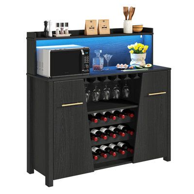 Features:Bar cabinet: The 47.2"W unique shape wine cabinet has 3 display wine racks that it most can hold 18 wine/champagne bottles following the different ages or manufacturers. The 47.2"W unique shape wine cabinet has a wine glass hang rack that most can hang 10-15 wine glasses to make the wine glass dry quickly. Colorful life: The 47.2"W wood wine cabinet with multi-color RGB LED lights. You flexibly change the light color with a remote control to follow your mood and music. It can mark you m Liquor Bar Cabinet, Coffee Bar Cabinet, Liquor Bar, Wine Bar Cabinet, Buffets And Sideboards, Wine Cabinet, Buffet Cabinet, Glass Holder, Wine Cabinets